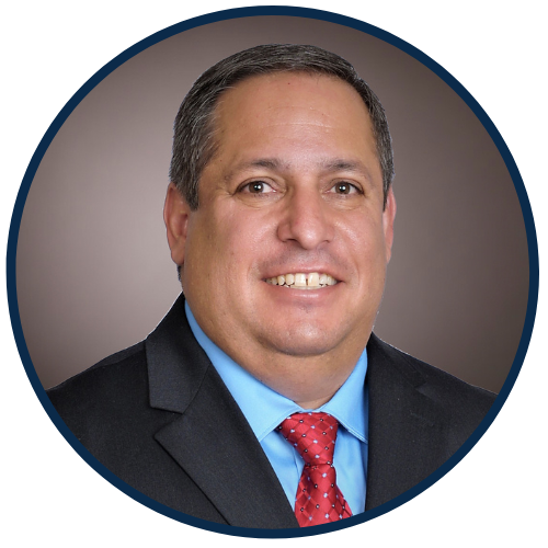 Circular headshot of CCDFI's New Mexico Specialist, Lawrence Chavez, with dark blue eborder