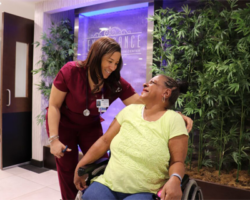 A warm moment between a healthcare worker and a resident at Renaissance, illustrating the care and personal connection in the facility.