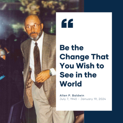 The image is a memorial graphic featuring a photo of Allen P. Baldwin. On the right side of the image, there's a large quotation that reads "Be the Change That You Wish to See in the World," set against a solid white background. Below the quote is the name "Allen P. Baldwin" in bold letters, followed by his birth and death dates "July 7, 1940 - January 19, 2024." Allen is pictured on the left side of the graphic, a mature man with a beard, wearing a suit and tie, and appears to be at a social event. The overall tone of the image is respectful and honors Allen P. Baldwin's memory and his inspirational message.