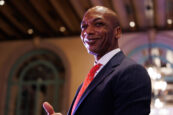 A smiling man in a suit giving a thumbs-up at the Clearinghouse CDFI 2024 Annual Shareholders Meeting
