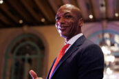 A smiling man in a suit giving a thumbs-up at the Clearinghouse CDFI 2024 Annual Shareholders Meeting