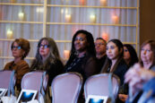 A focused audience listening to a presentation at the Clearinghouse CDFI 2024 Annual Shareholders Meeting