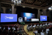 Wide shot of an empty conference room setup for the Clearinghouse CDFI 2024 Annual Shareholders Meeting with chairs and screens