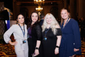 Four women smiling at the camera during the Clearinghouse CDFI 2024 Annual Shareholders Meeting.