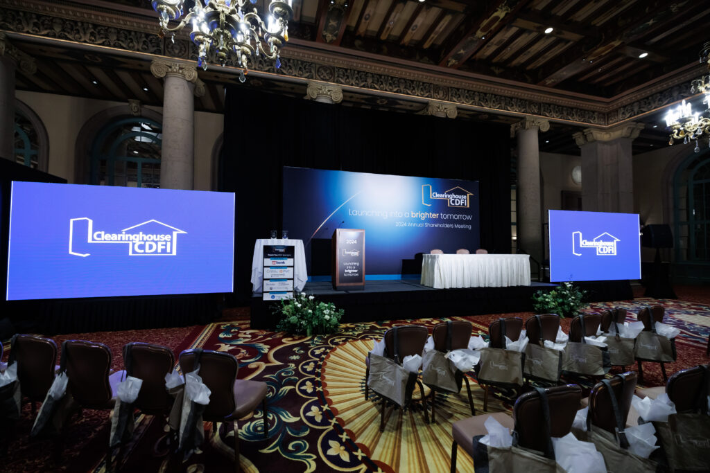 Clearinghouse CDFI 2024 Annual Shareholders Meeting stage in the Emerald Room of the Biltmore Hotel in Los Angeles. 