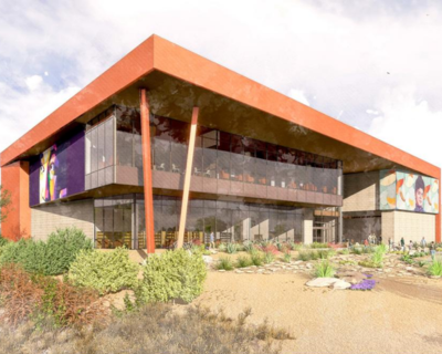 Architectural rendering of the new West Las Vegas Library, showcasing a modern two-story building with large glass windows and vibrant murals.