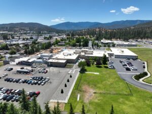 Aerial view of Fairchild Medical Center in Yreka, CA, highlighting facility buildings, parking areas, and scenic mountain surroundings.