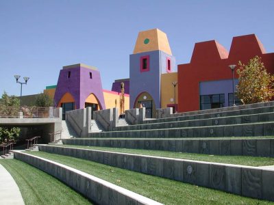 Exterior shot of Clearinghouse CDFI NMTC recipient Market Creek's colorful amphitheater, with blue, purple, pink, orange, and yellow buildings and numerous steps