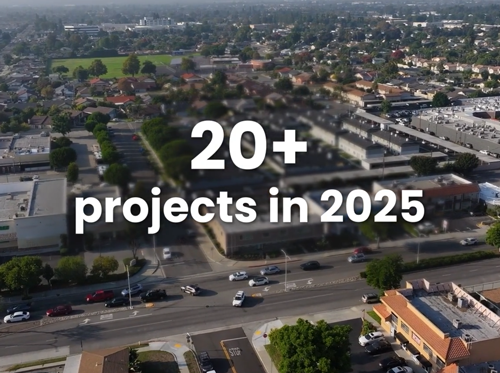 Aerial view of a community neighborhood with overlay text “20+ projects in 2025” representing Clearinghouse CDFI annual video impact